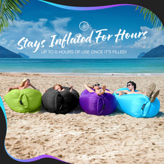 Beach scene with Nevlers inflatable lounge ready for sun and relaxation.