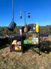 Nice C camping kitchen station light-stand-windshield demonstrates windproof cooking at campsite.
