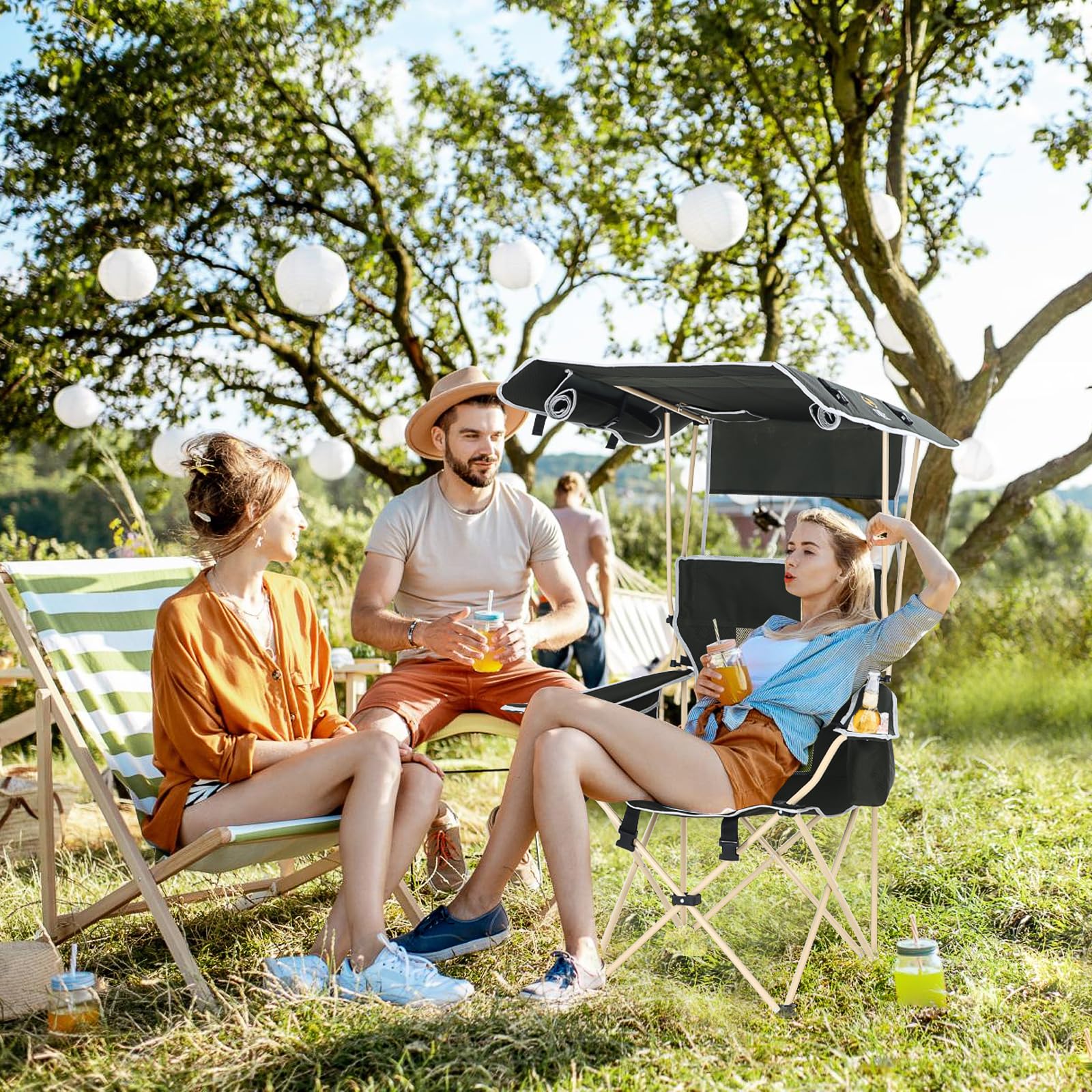 Nice C Chair with Canopy outdoor camping scene showing portable, backpack-style carry.