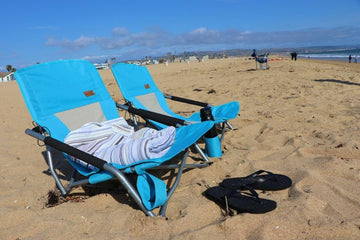 Nice C Low Beach Chair blue in use on sand for comfort