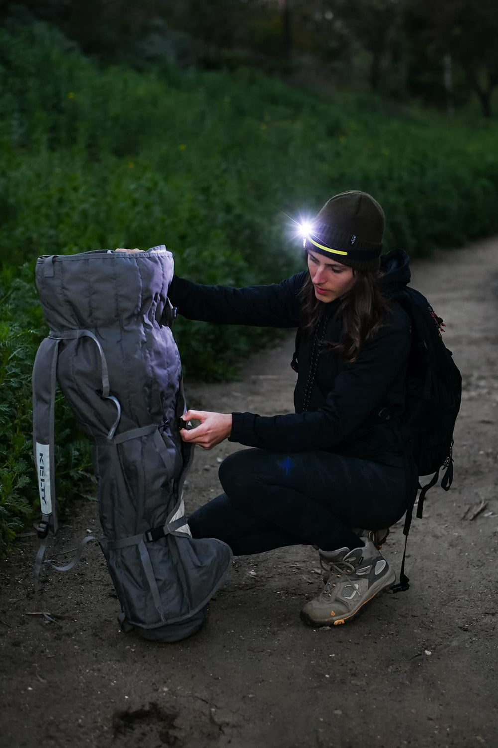 NightBuddy headlamp submerged to show IPX7 waterproof rating