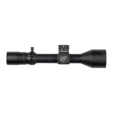 Nightforce NX8 50mm objective lens highlighting light transmission in dim conditions.