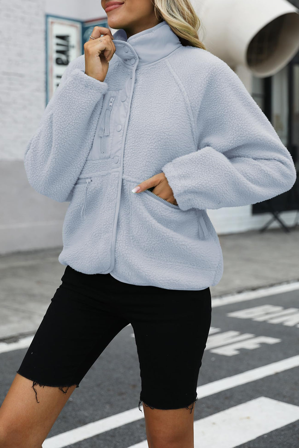Nirovien fleece jacket dusty blue side view highlights cropped silhouette for layering