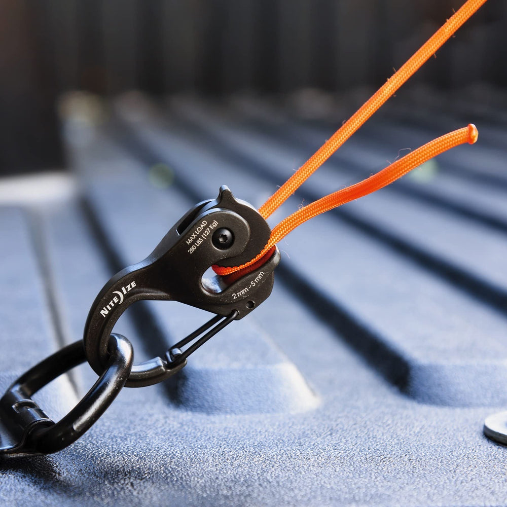 Nite Ize CamJam XT black 16 ft paracord included for quick setup.