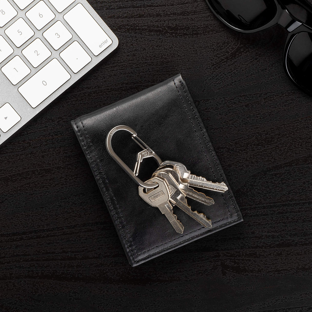 Bottom chamber keeps keys securely attached during daily activities