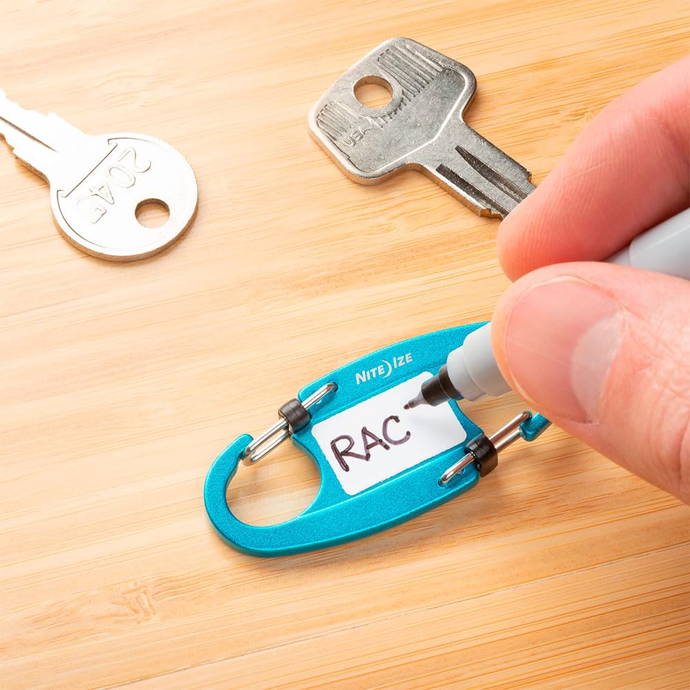 Nite Ize IdentiKey SlideLock close-up of waterproof write-on tab for durable key labels