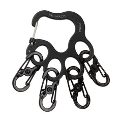 Nite Ize Pawprint Locker KeyRack clipped to a belt with slide-to-lock mechanism.