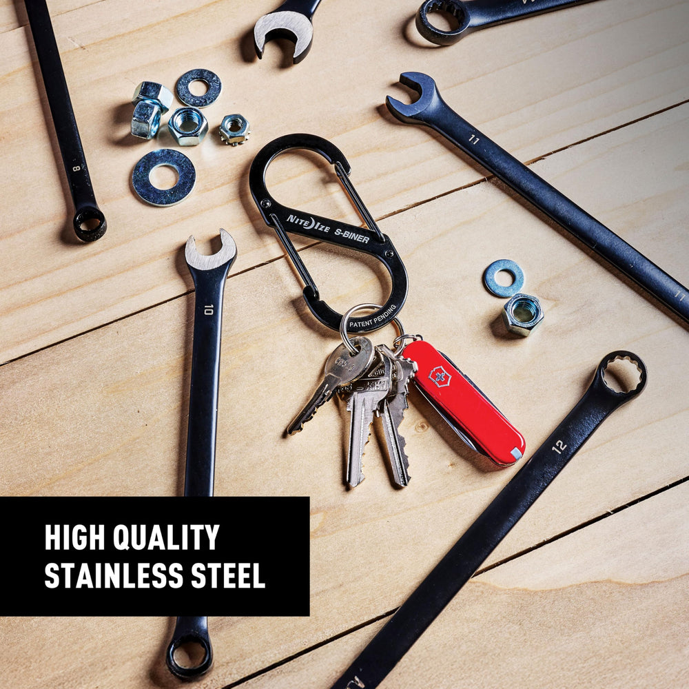 Nite Ize S-Biner clipped to backpack strap for secure key organization.