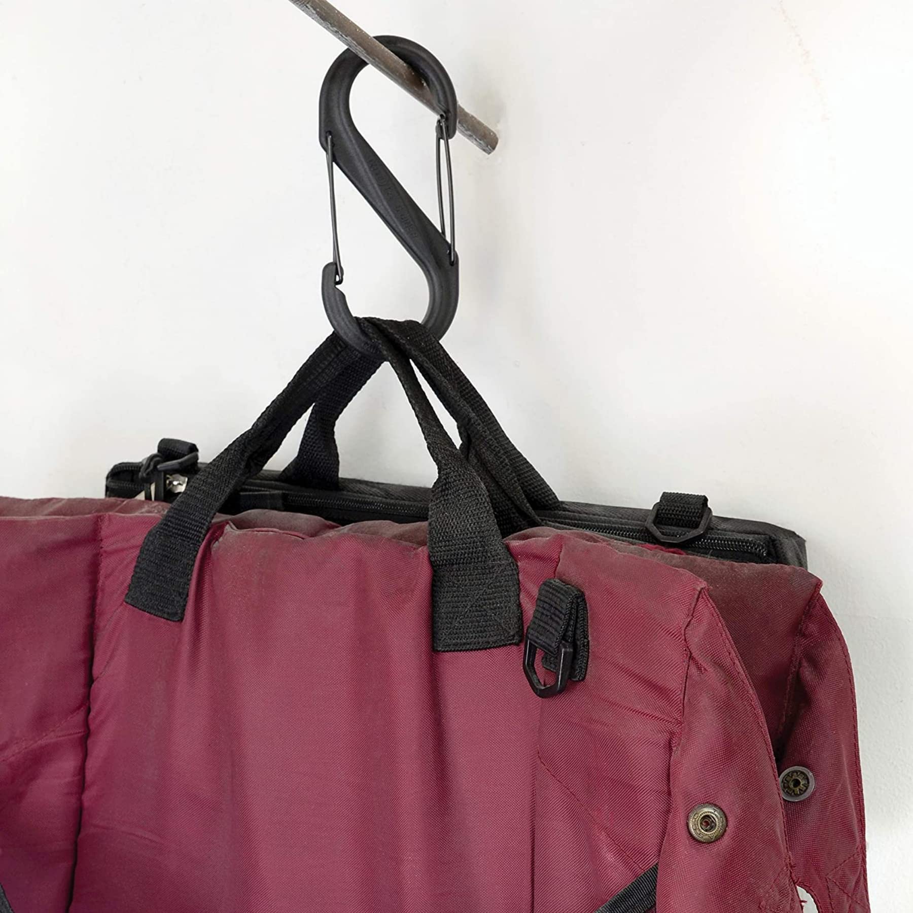 Nite Ize S-Biner #8 over a stroller handle for hands-free organization.