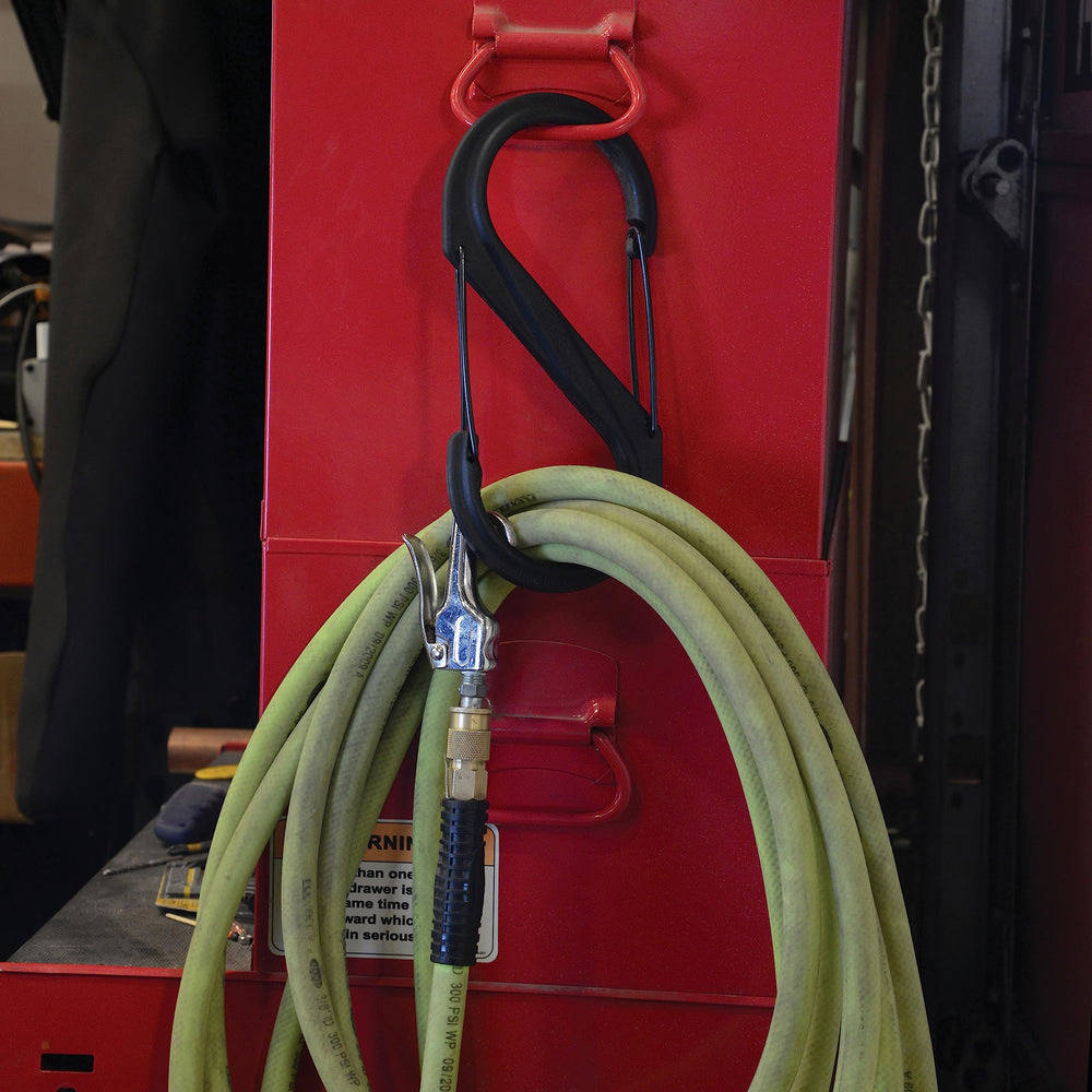 Nite Ize S-Biner stretches between stroller handles and closet rods for clutter-free storage.