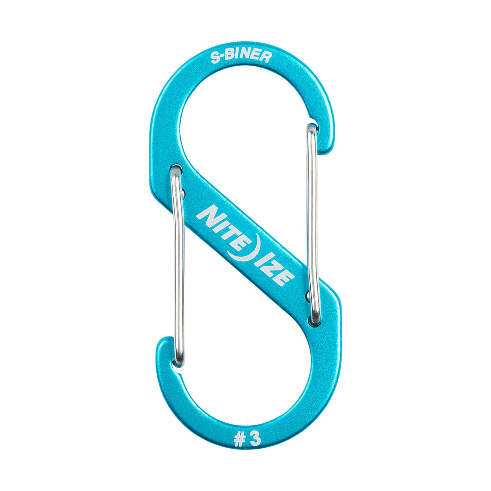 Nite Ize Size-3 S-Biner blue side gate on a backpack strap.