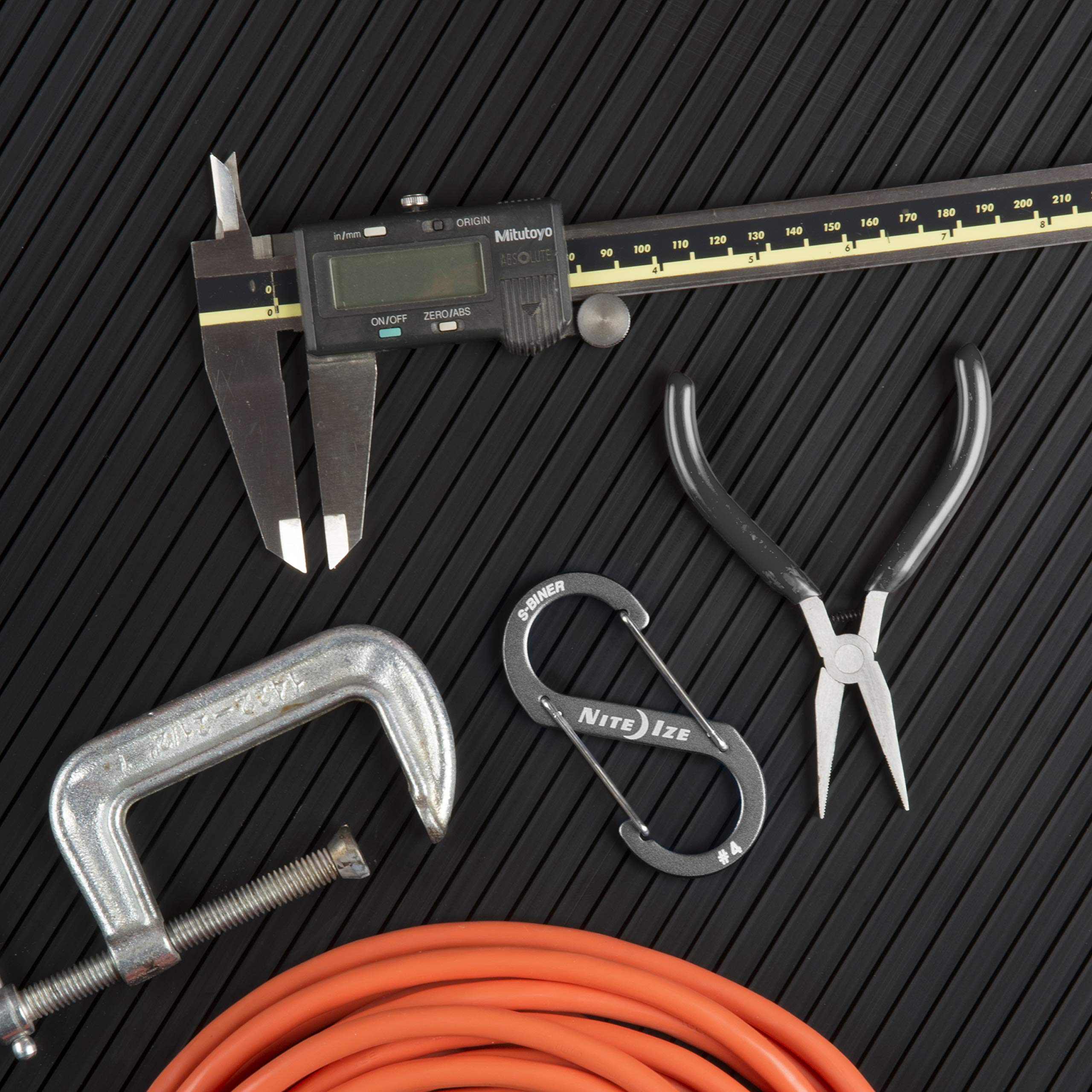 Slim profile stays unobtrusive on belts, pockets, or backpack straps