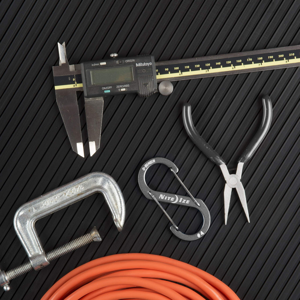 Slim profile stays unobtrusive on belts, pockets, or backpack straps