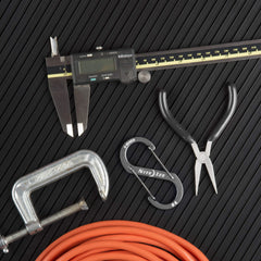 Slim profile stays unobtrusive on belts, pockets, or backpack straps