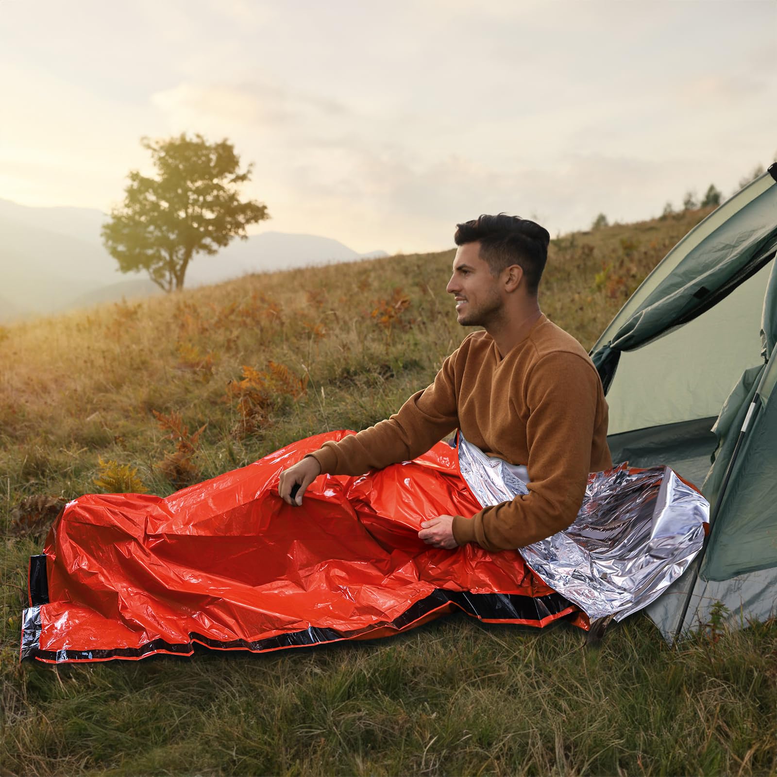 Noamus orange bivy increases visibility for rescue during outdoor activities.