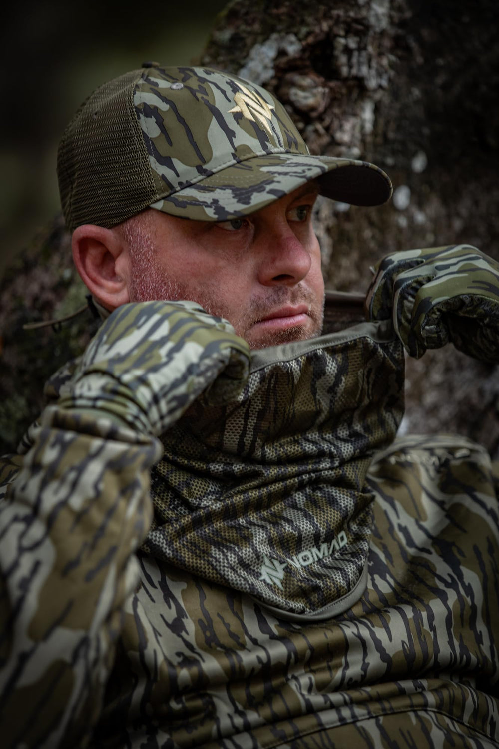 NOMAD Mossy Oak Bottomland camo blends with field surroundings