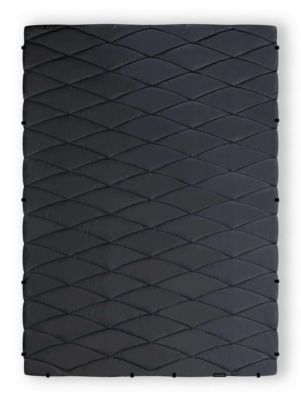 Nomadix Puffer Blanket compact for travel and everyday car trips.