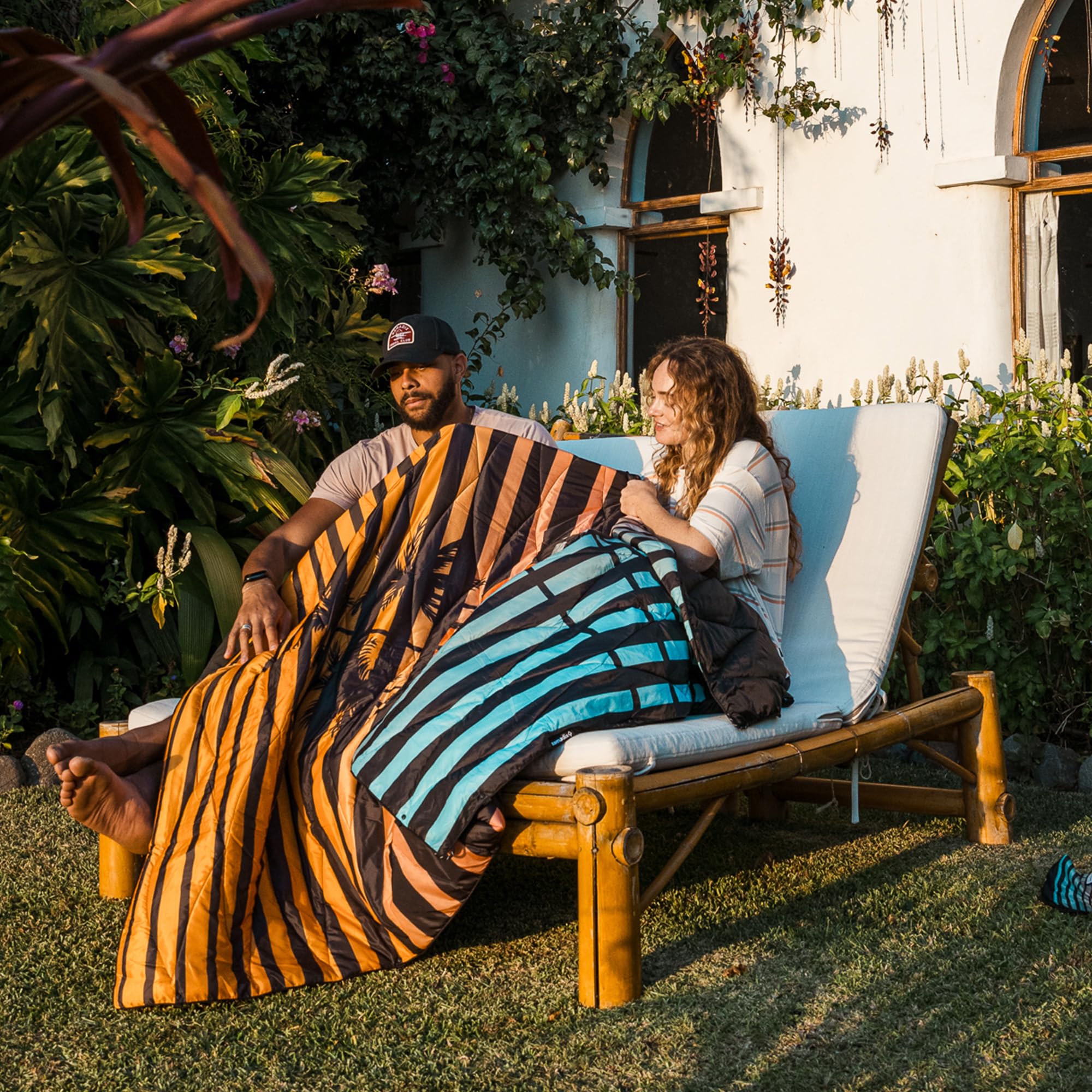 Nomadix Puffer Blanket side snaps enable versatile wearing options.