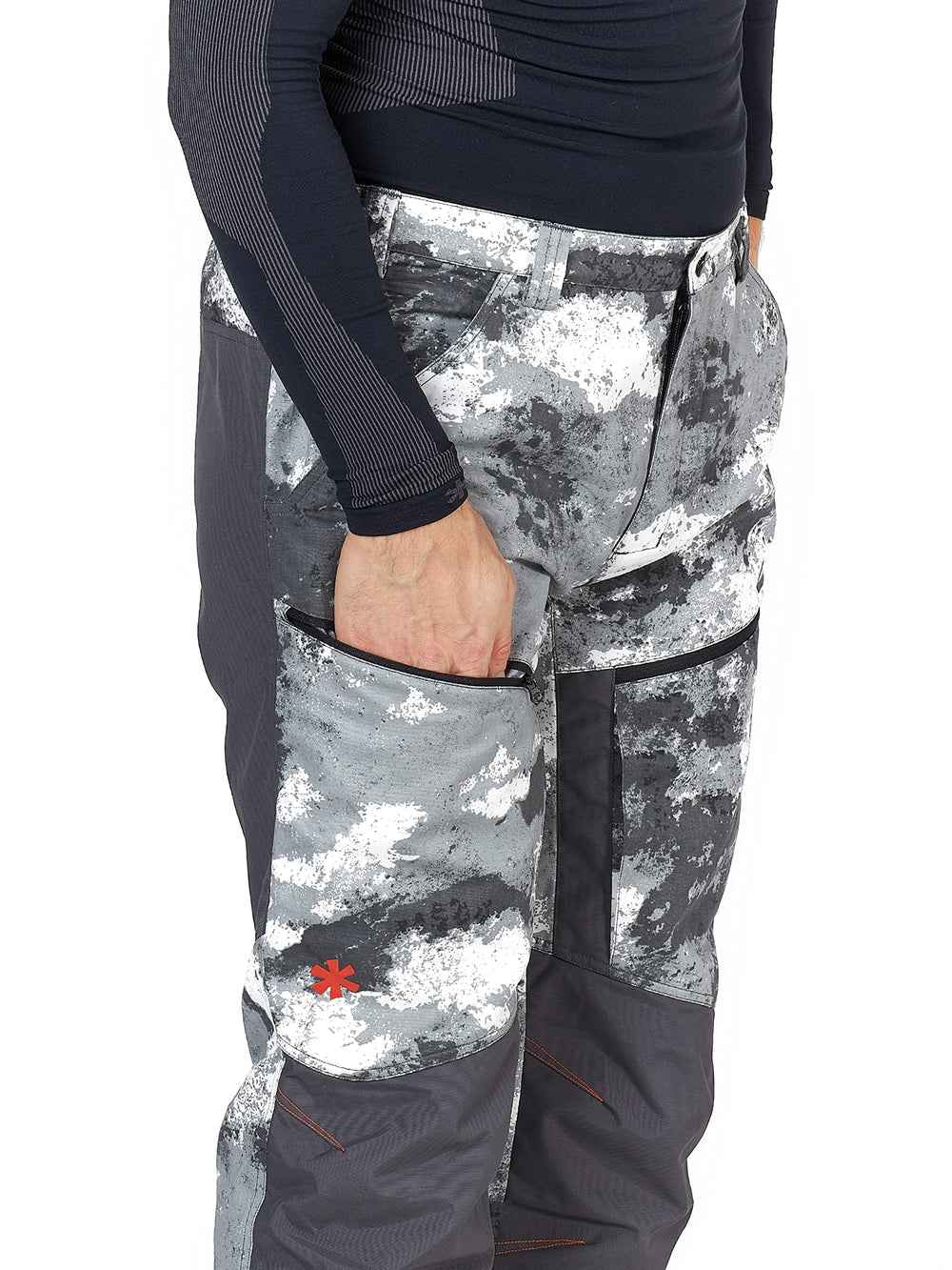 NORFIN Sigma Canvas Pants worn by an outdoor angler in camo.