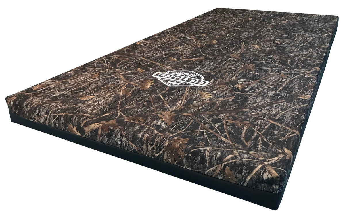 North American Mattress Trapper Bed top view highlighting four-inch cushion for camping comfort and support