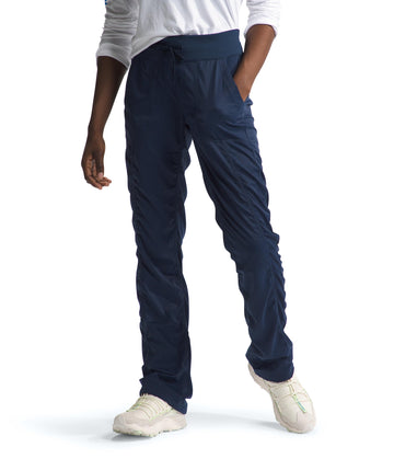 The North Face Aphrodite 2.0 Pant on trail shows moisture-wicking comfort for hiking.