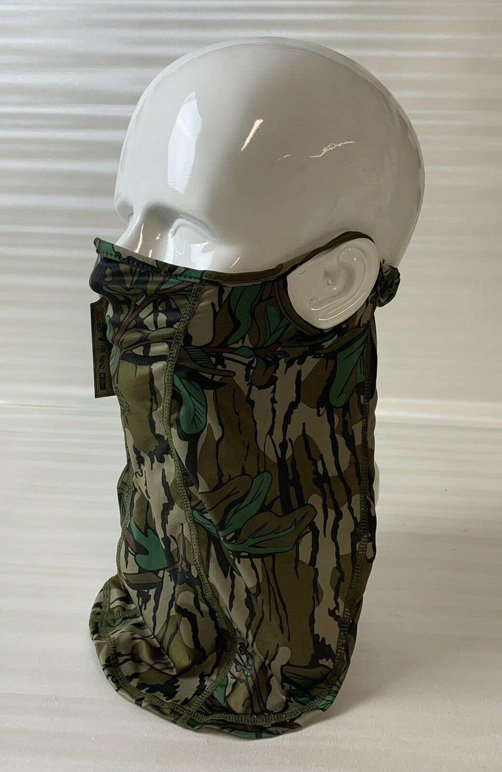 North Mountain Gear Mossy Oak Loose Fit Facemask Greenleaf side view shows extended coverage and comfort