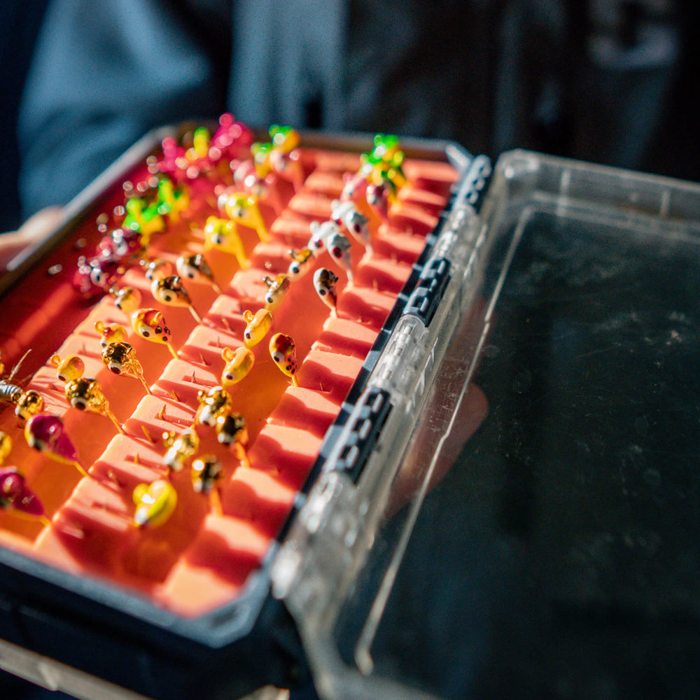 Northland Impulse Mayfly Jig ideal for ice fishing with two sizes and five colors.