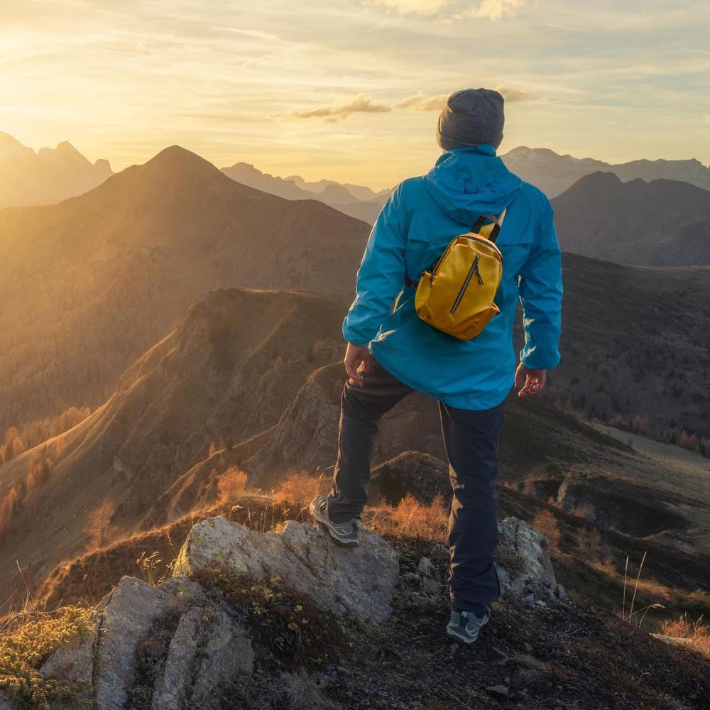 Nupouch lightweight sling bag in bright yellow boosts visibility and style.