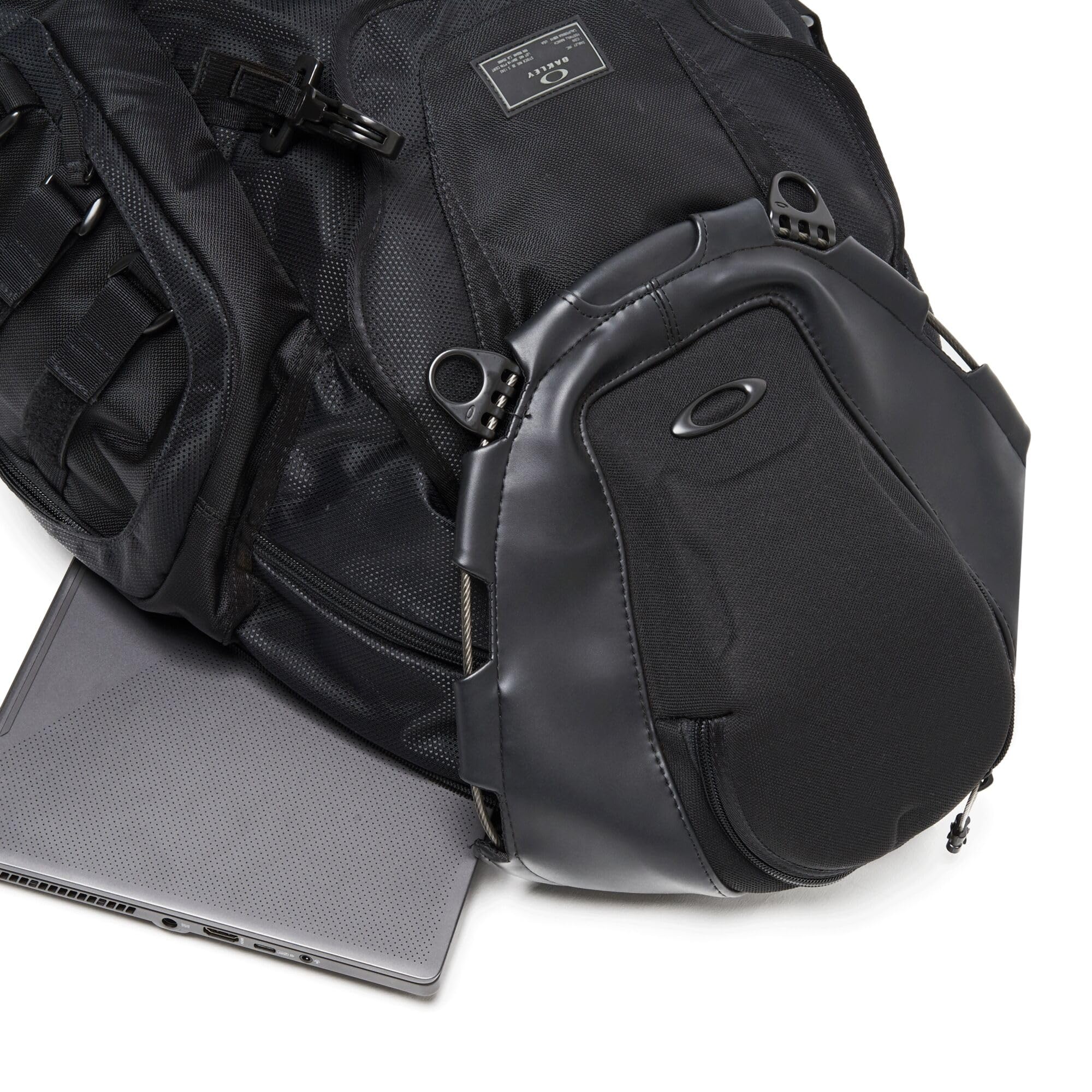 Oakley Kitchen Sink Backpack stealthblack padded back panel boosts comfort during long carries.