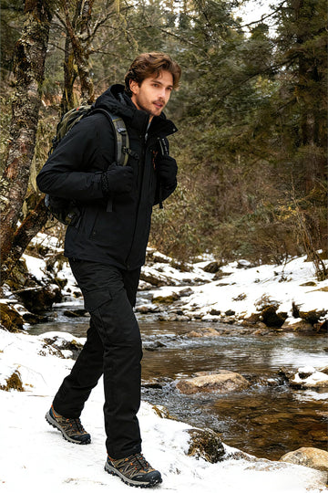 OCANXUE camo waterproof pants in-use on rugged outdoor terrain.