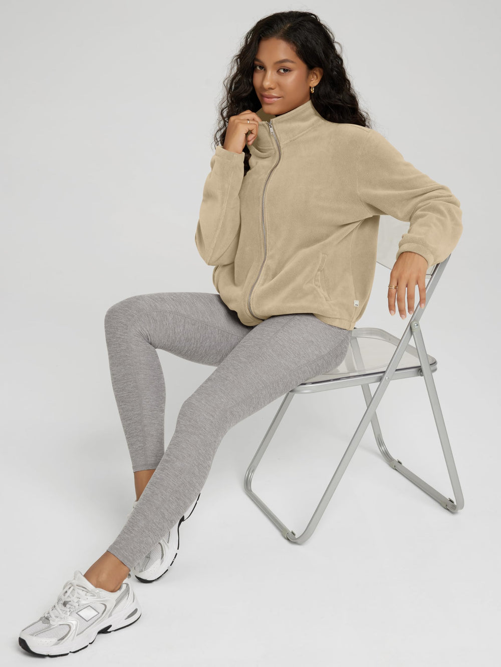 ODODOS polar fleece jacket sandstone funnel-neck closeup highlights warmth and style.