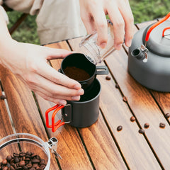 Odoland folding camping mug with insulated handle for hot beverages outdoors.