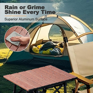 Odoland folding camping table anti-slip legs provide stable footing on grass or sand.