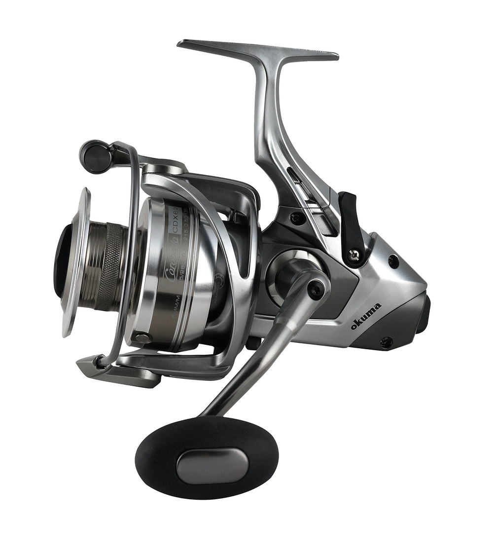 Okuma CDX-65 Coronado reel top view highlighting compact bait feeder design for precision casting