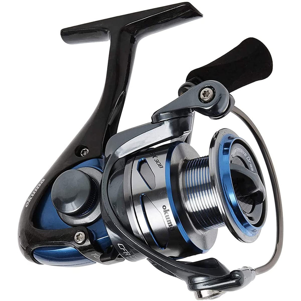 Okuma Inspira blue carbon-frame reel side profile emphasizes balanced feel during retrieve.