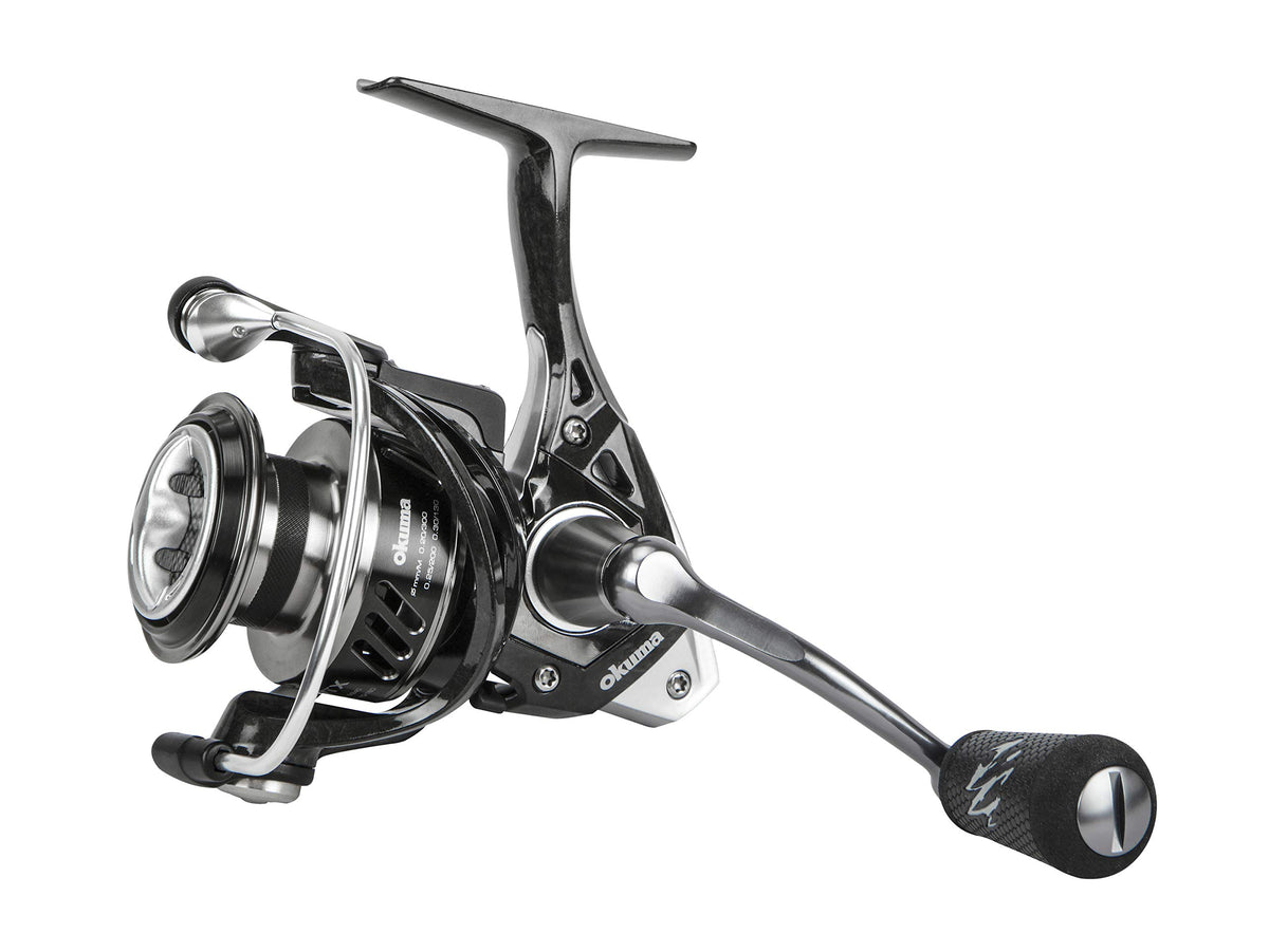 OKUMA ITX-1000H spinning reel side view shows rugged construction for demanding fishing.