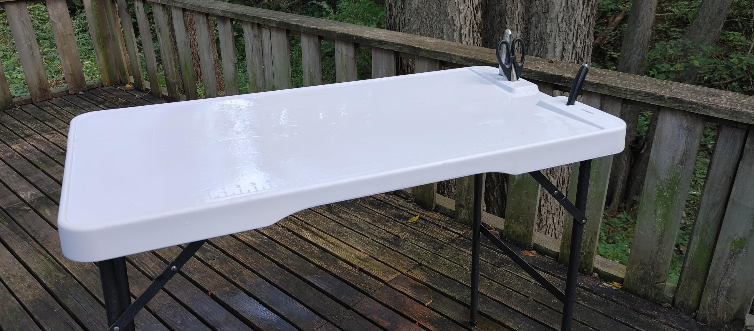 Old Cedar Outfitters cleaning table built-in ruler helps measure quick layouts