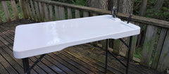 Old Cedar Outfitters cleaning table built-in ruler helps measure quick layouts