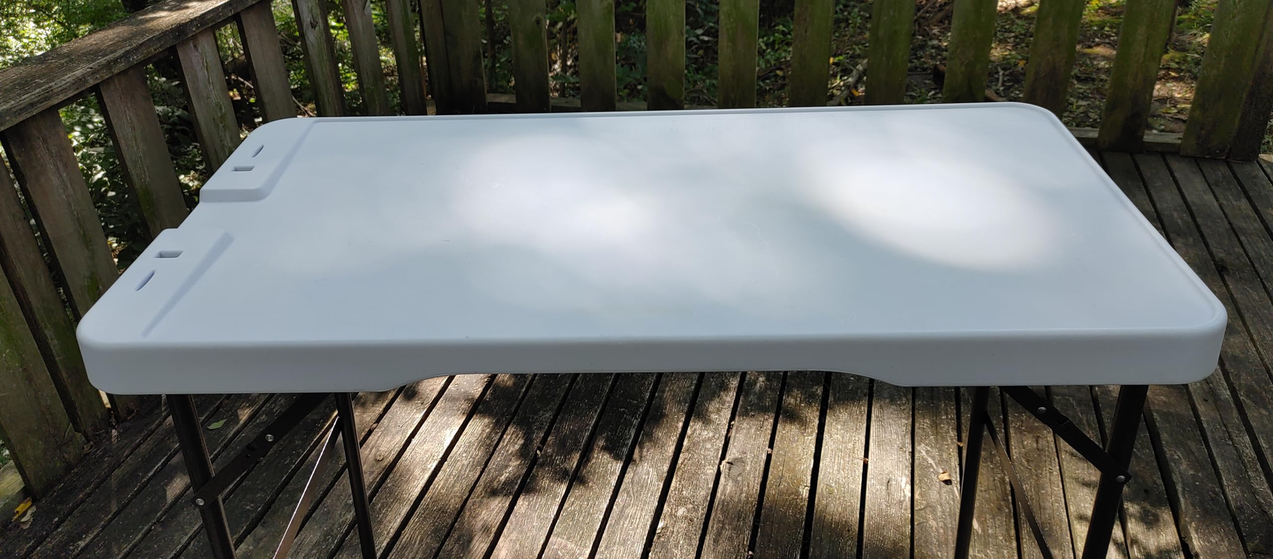 Old Cedar Outfitters cleaning table with slanted top aiding efficient drainage during tasks