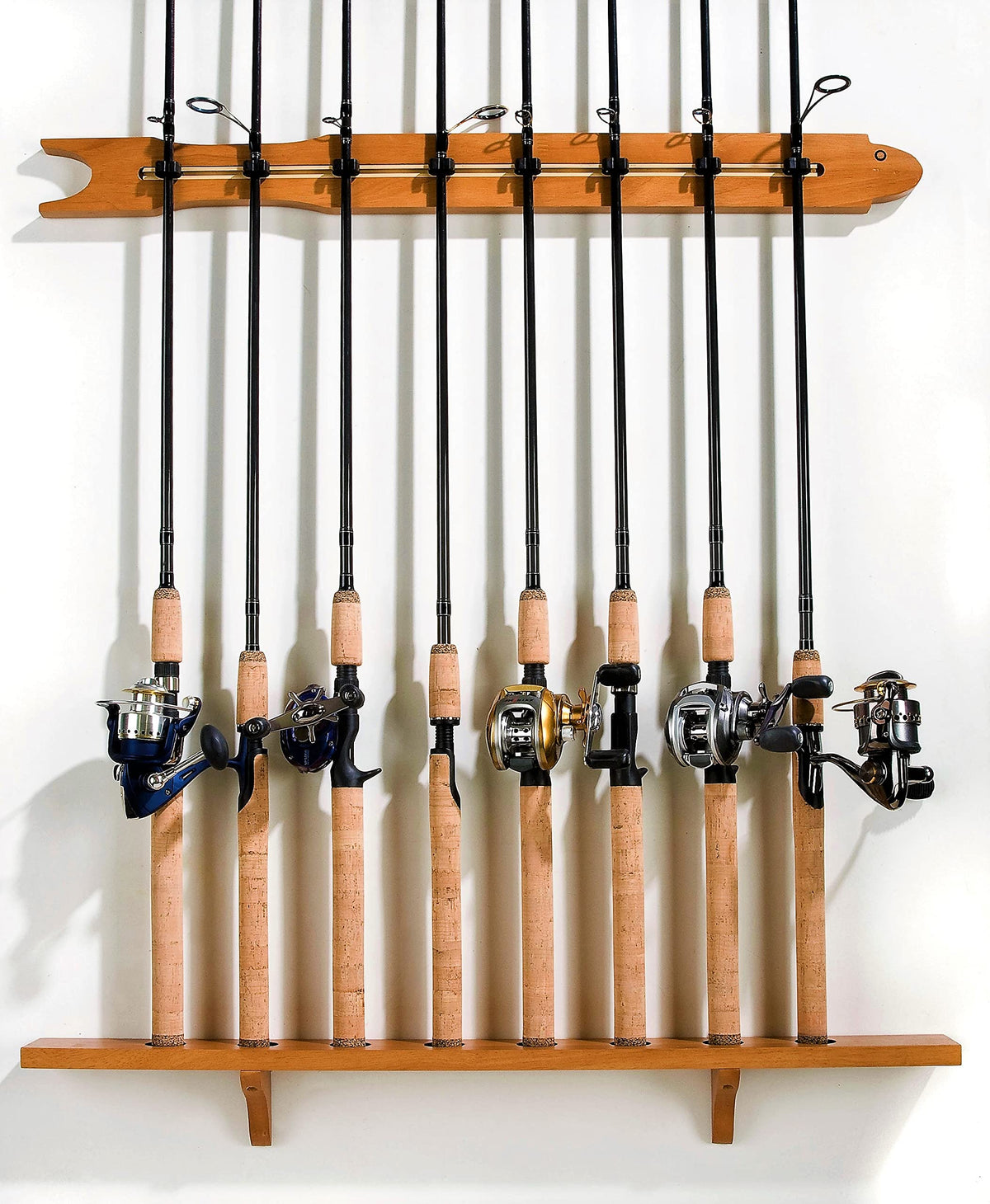 Old Cedar Outfitters modular wall rack with eight-rod storage in pine finish, keeping gear organized.