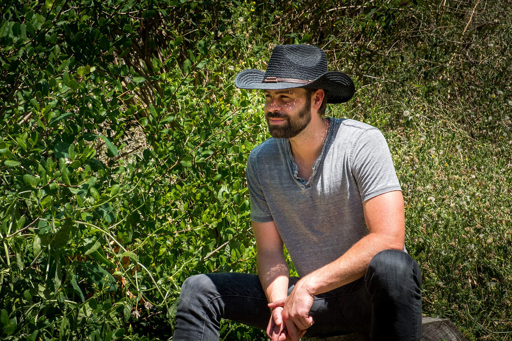 Old Stone Chloe Black straw cowboy hat outdoor setting on the move