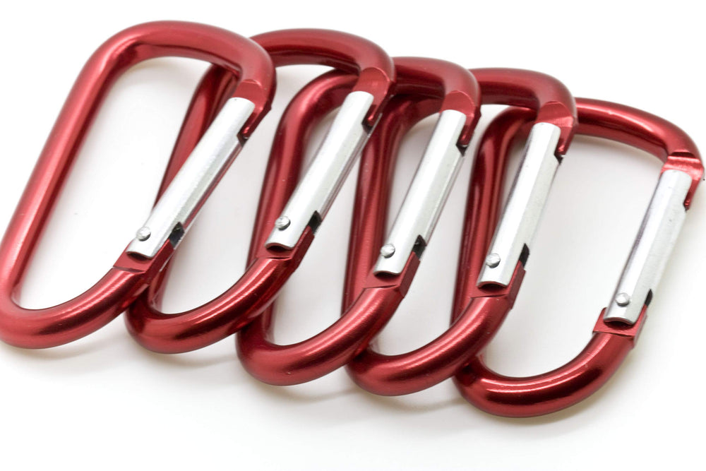 ONDEPOT red 3-inch carabiner clipped on a bag for one-handed use.