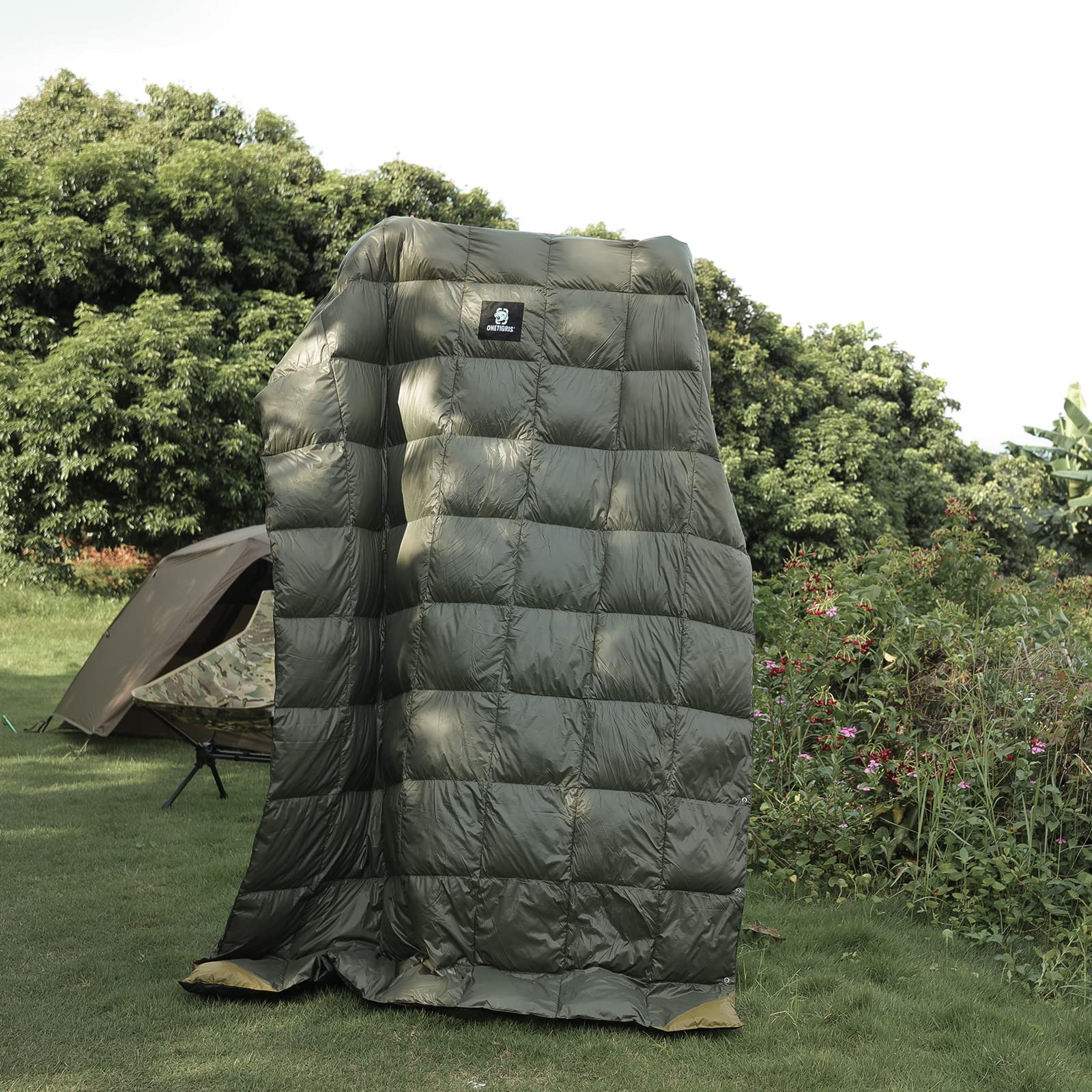 OneTigris down camping blanket close-up showing puffed insulation for reliable warmth.