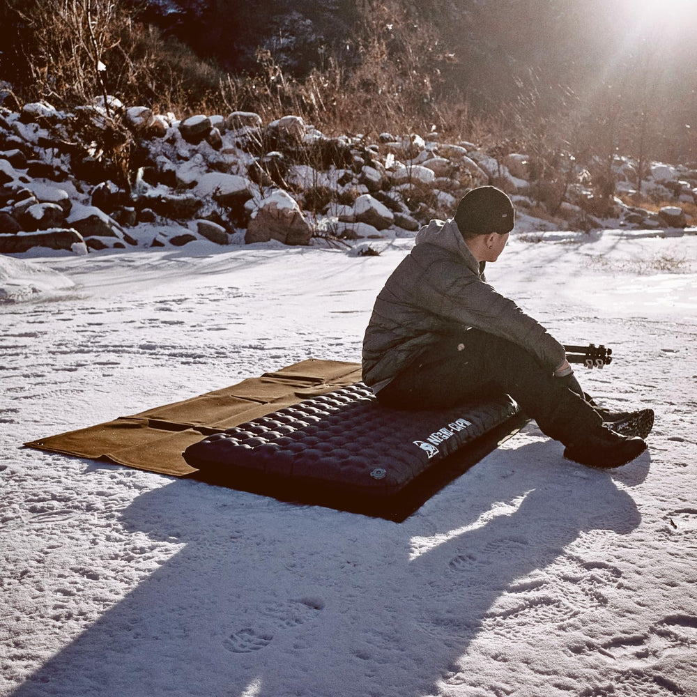 ONETIGRIS Obsidian ultralight sleeping pad rolled for compact backpacking storage.
