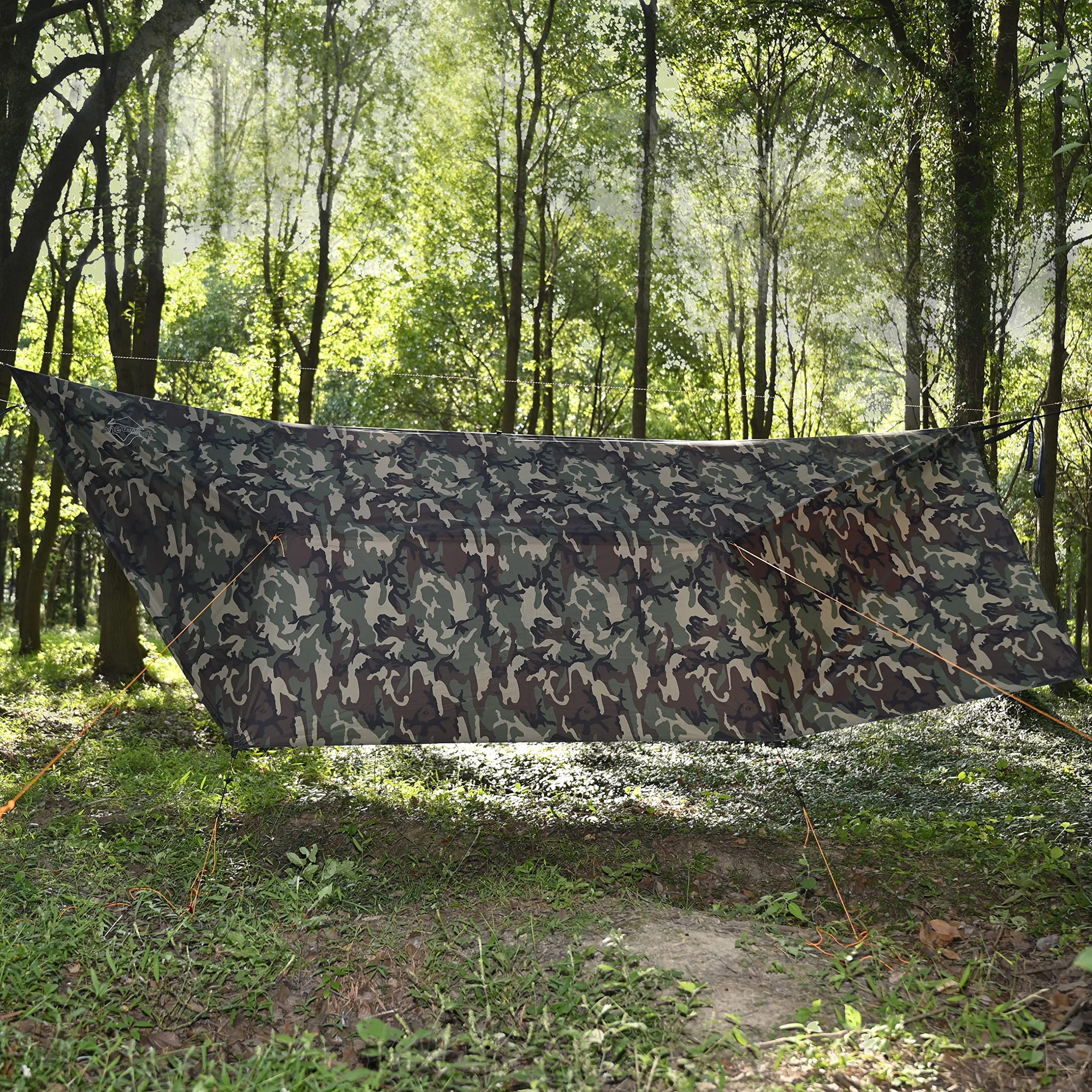 Onewind camo tarp hammock area shows versatile shelter for hammock setups