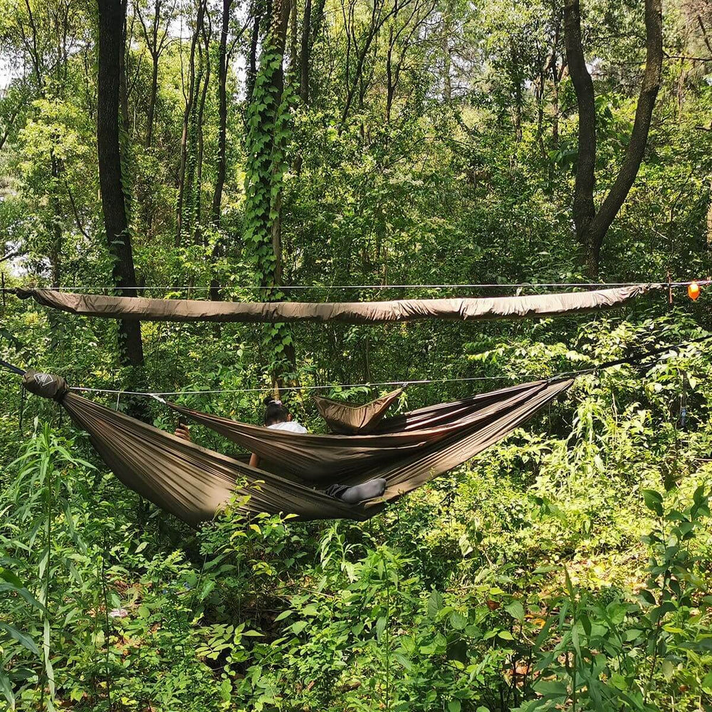 Onewind Peak Storage Hammock in use keeps gear organized above the hammock.
