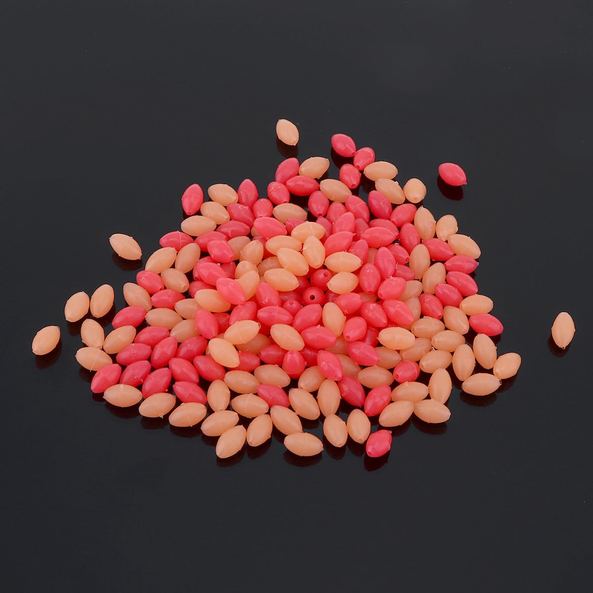 Beads threaded onto a fishing line with center holes