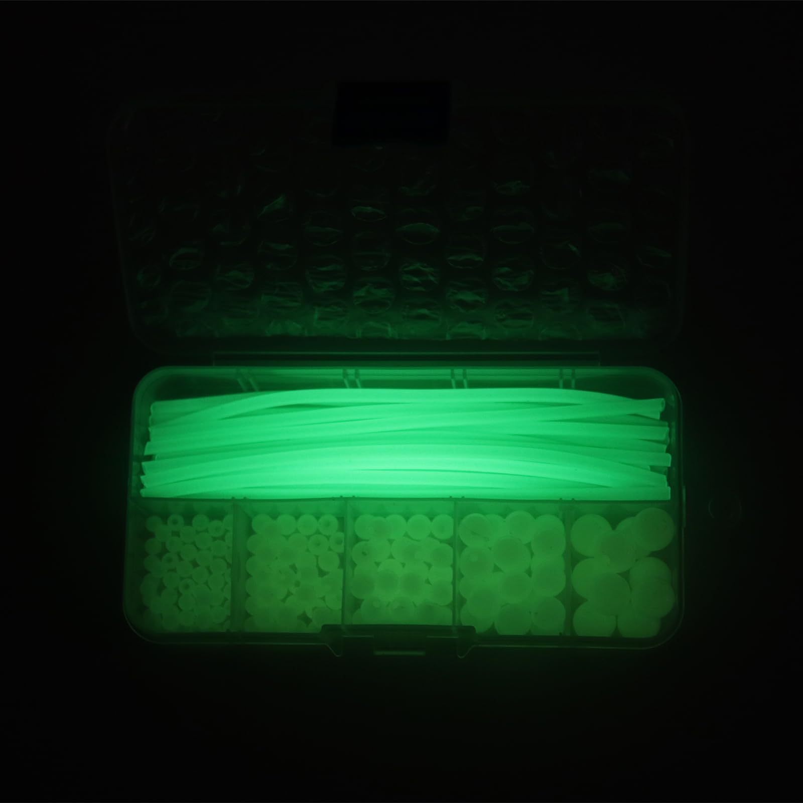 Glow beads glowing in the dark after sunlight exposure