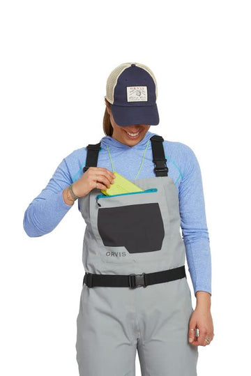 Orvis Clearwater waders in stone color blending with river surroundings