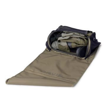 Orvis Wader Mud Room Tote in dusty olive, floor-standing area for easy gear changes.